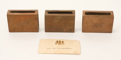 Lot 25 - Alfred de Rothschild, 1842-1918. A set of three copper table matchbox holders, each engraved “AdeR”, together with a personal calling card of Anthony de Rothschild