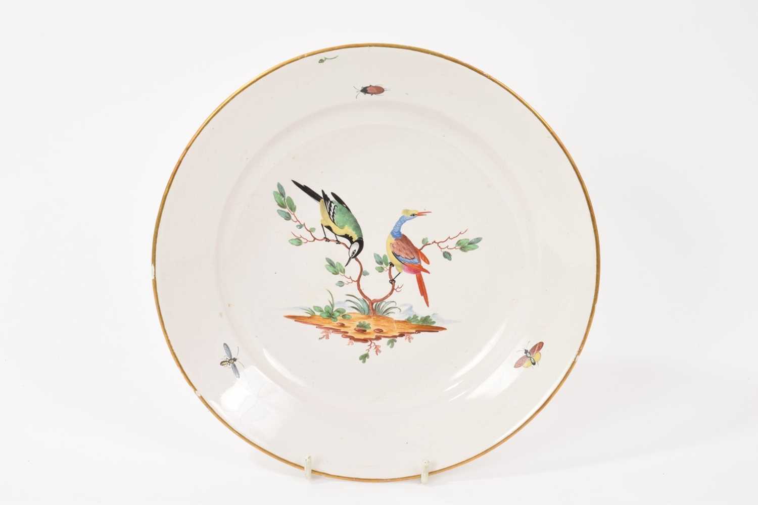 Lot 39 - 18th century Niderviller tin glazed earthenware plate, with polychrome ornithological bird and insect decoration, marked to base