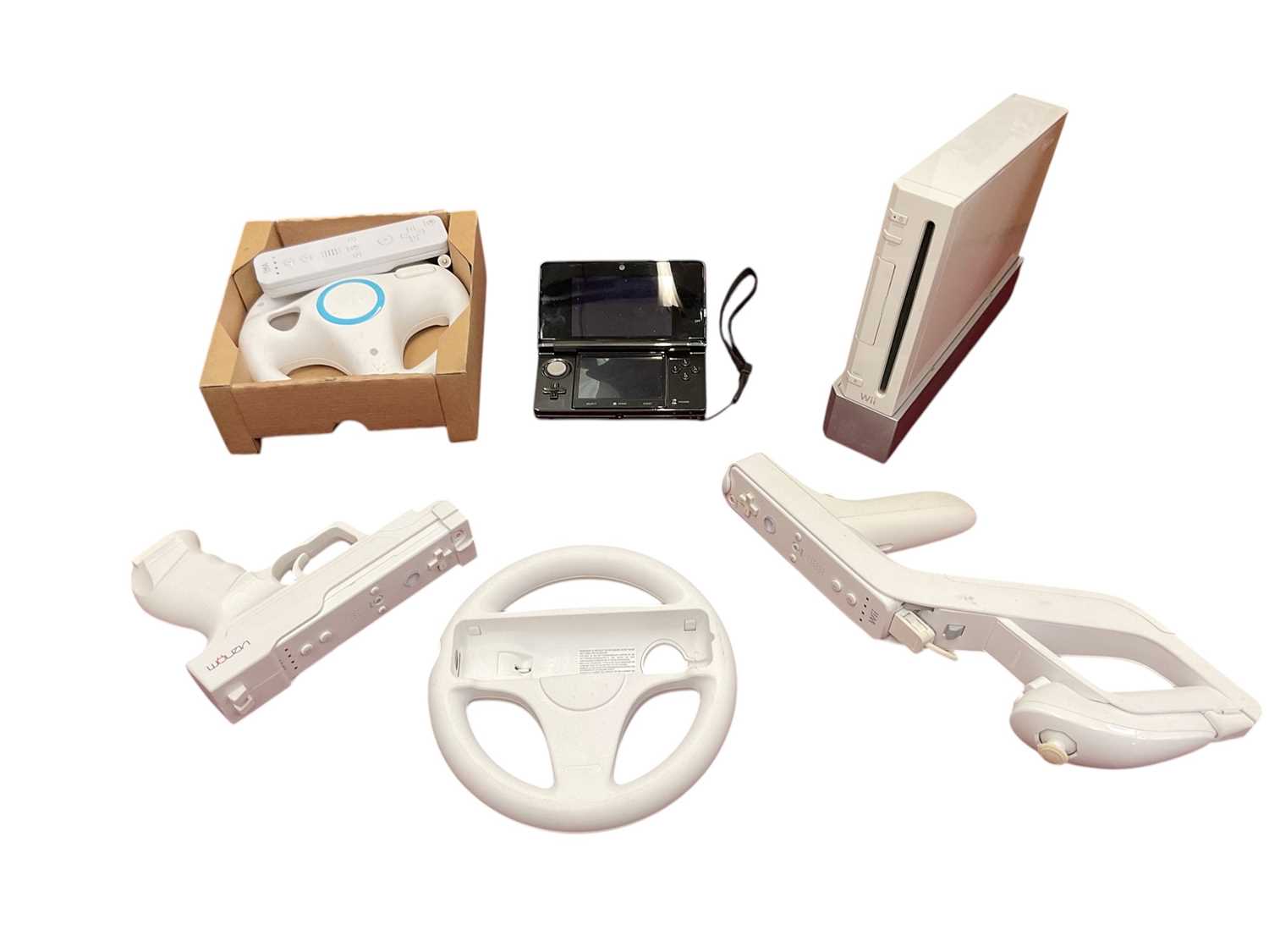 Lot 1984 - Nintendo Wii with accessories and 11 games together with Nintendo 3DS in cosmo black with approximately 30 games