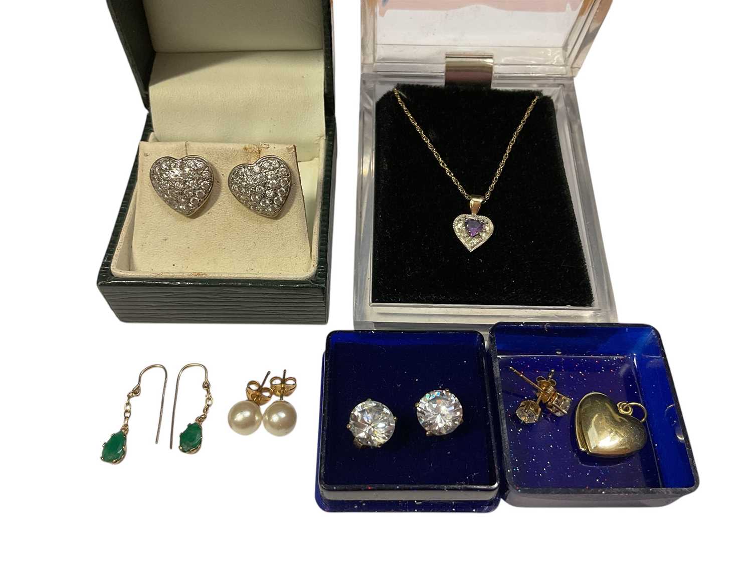 Lot 102 - 9ct gold amethyst pendant on 9ct gold chain, gold (333) heart locket and five pairs of gold gem set earrings