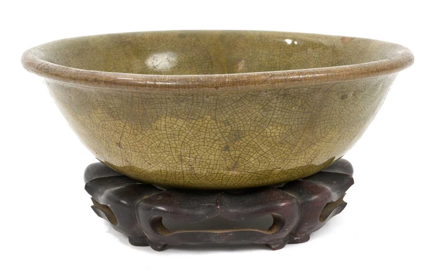 Lot 43 - Early Chinese celadon glazed bowl, with hardwood stand