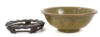 Lot 43 - Early Chinese celadon glazed bowl, with hardwood stand