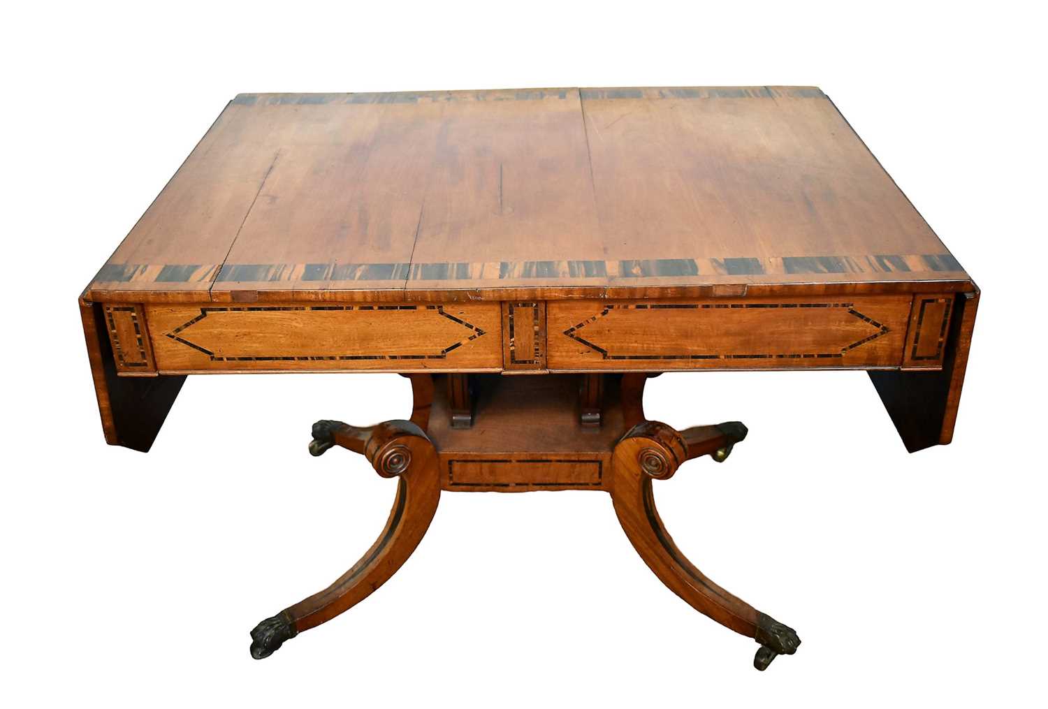 Lot 1537 - George IV mahogany and calamander sofa table with twin frieze drawers, on double lyre central supports and four splayed legs with brass capped castors, 152cm extended