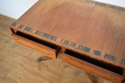 Lot 1537 - George IV mahogany and calamander sofa table with twin frieze drawers, on double lyre central supports and four splayed legs with brass capped castors, 152cm extended