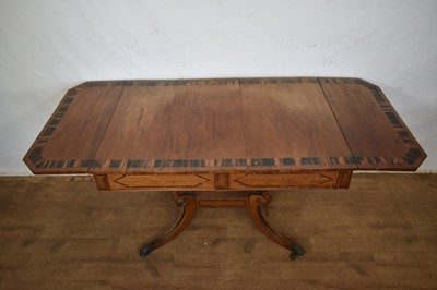 Lot 1537 - George IV mahogany and calamander sofa table with twin frieze drawers, on double lyre central supports and four splayed legs with brass capped castors, 152cm extended