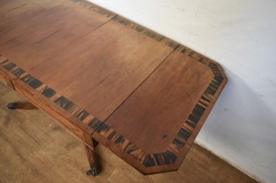 Lot 1537 - George IV mahogany and calamander sofa table with twin frieze drawers, on double lyre central supports and four splayed legs with brass capped castors, 152cm extended