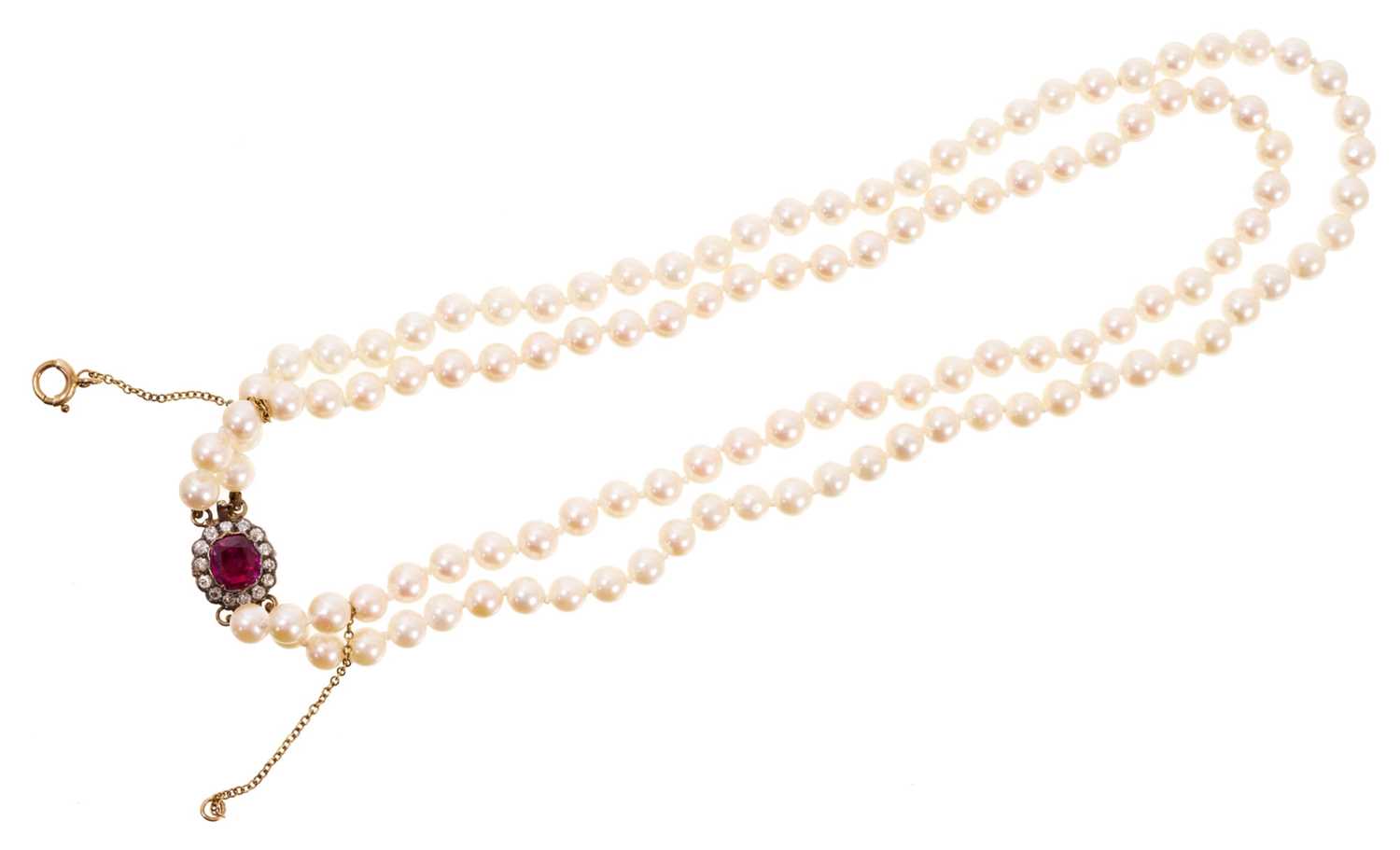 Lot 488 - Cultured pearl two-strand necklace on an antique ruby and diamond cluster clasp