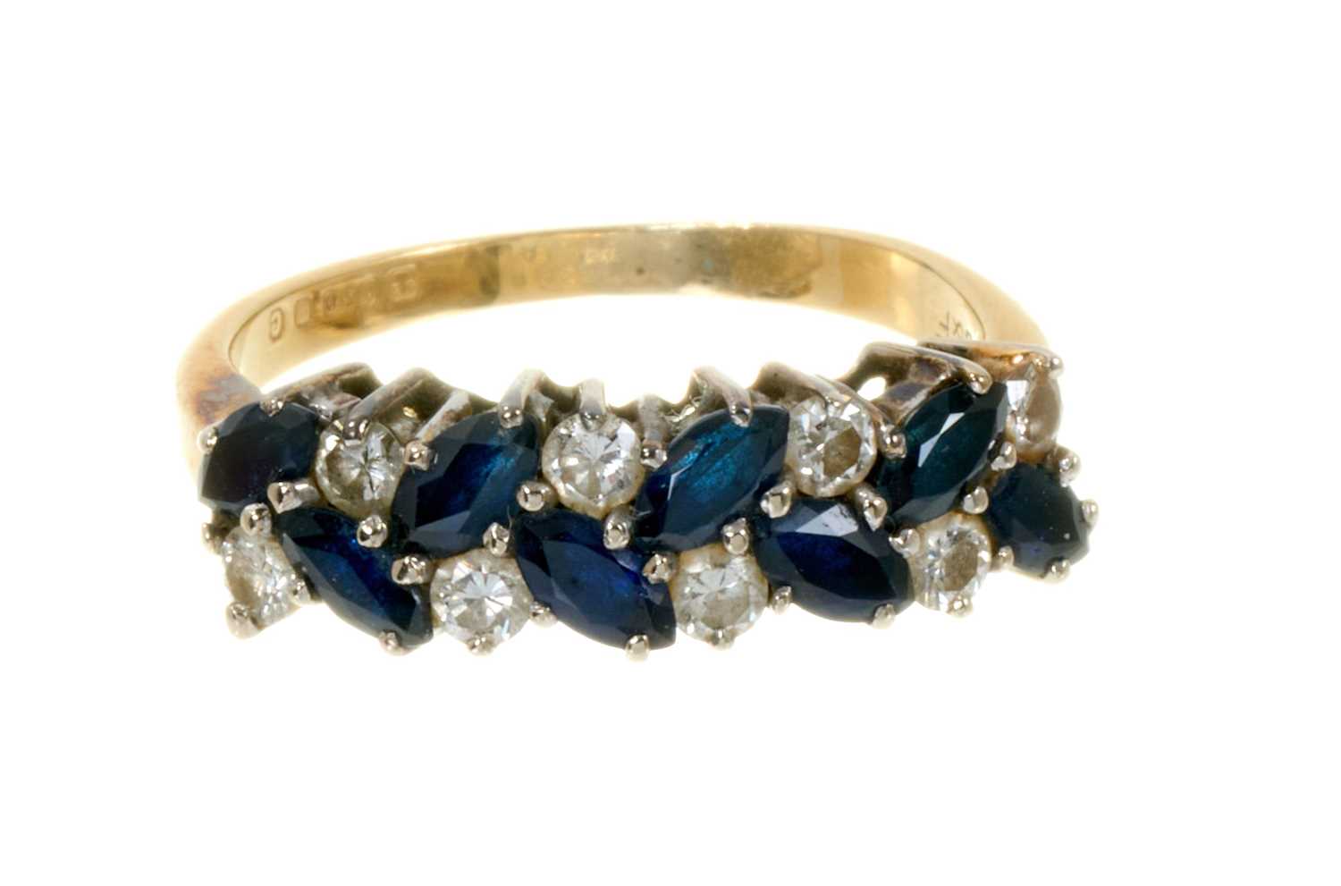 Lot 492 - Sapphire and diamond eternity ring with a double row of marquise-cut blue sapphires and brilliant cut diamonds
