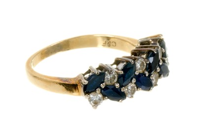 Lot 492 - Sapphire and diamond eternity ring with a double row of marquise-cut blue sapphires and brilliant cut diamonds