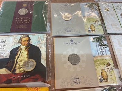 Lot 493 - G.B. - Royal Mint uncirculated flatpack coins to include Fifty Pence Beatrix Potter x 14, Classic Pooh x 4, Paddington Bear x 2, Beatrix Potter Treasure of Life coin collection album 2017 (N.B....