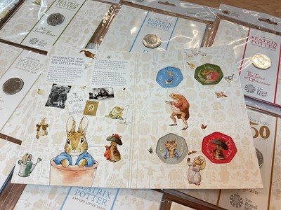 Lot 493 - G.B. - Royal Mint uncirculated flatpack coins to include Fifty Pence Beatrix Potter x 14, Classic Pooh x 4, Paddington Bear x 2, Beatrix Potter Treasure of Life coin collection album 2017 (N.B....