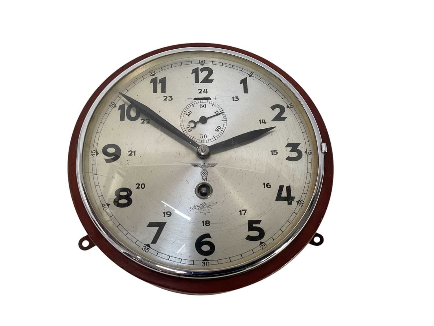 Lot 738 - Second World War Nazi German Kriegsmarine ships bulkhead clock in red painted metal case, with silvered Arabic numeral dial with Eagle Swastika above 'M' and subsidiary seconds dial.