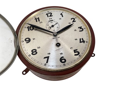 Lot 738 - Second World War Nazi German Kriegsmarine ships bulkhead clock in red painted metal case, with silvered Arabic numeral dial with Eagle Swastika above 'M' and subsidiary seconds dial.