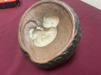 Lot 105 - Sculpture of an apple with child inside