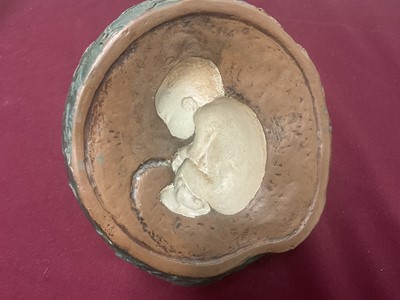 Lot 105 - Sculpture of an apple with child inside
