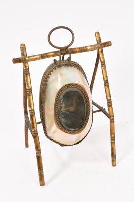 Lot 823 - Three 19th century novelty mother of pearl watch holders