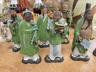 Lot 63 - Eight Chinese pottery figures of Immortals
