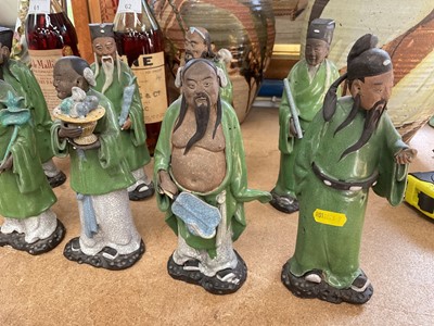 Lot 63 - Eight Chinese pottery figures of Immortals