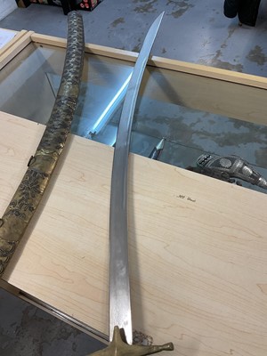 Lot 891 - Old African sword, similar spear, reproduction Indian cavalry sword and another Indian sword (4).