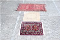 Lot 1771 - Pakistani rug - brick-red field with row of...