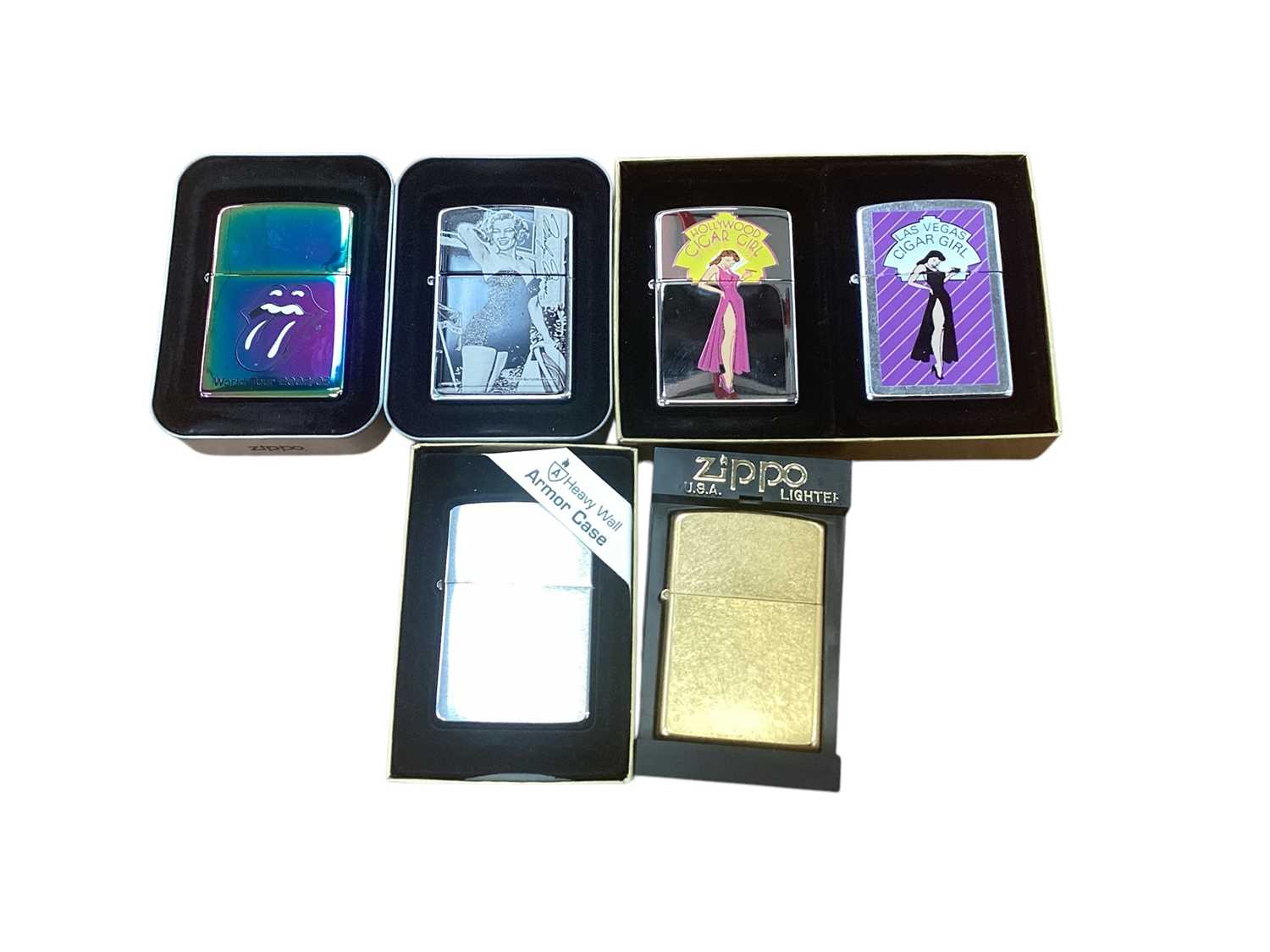 Lot 2591 - Group of six Zippo lighters including Rolling Stones World Tour, Marlboro, Stars of Hollywood and others in original boxes (6).