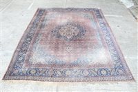 Lot 1775 - Large Kashan carpet - the claret field centred...