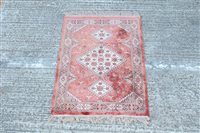 Lot 1776 - Small Eastern silk rug - with salmon-pink...