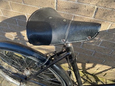 Lot 2689 - Vintage Sunbeam bicycle in black painted finish with white wartime black out type paint to rear mudguard and wicker shopping basket.
