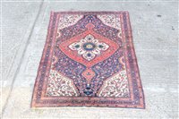 Lot 1777 - Persian rug - with concentric petalled...