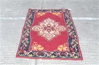 Lot 1779 - Kelim rug - with claret ground and central...