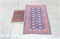 Lot 1780 - Small Eastern rug - with wavy field and two...