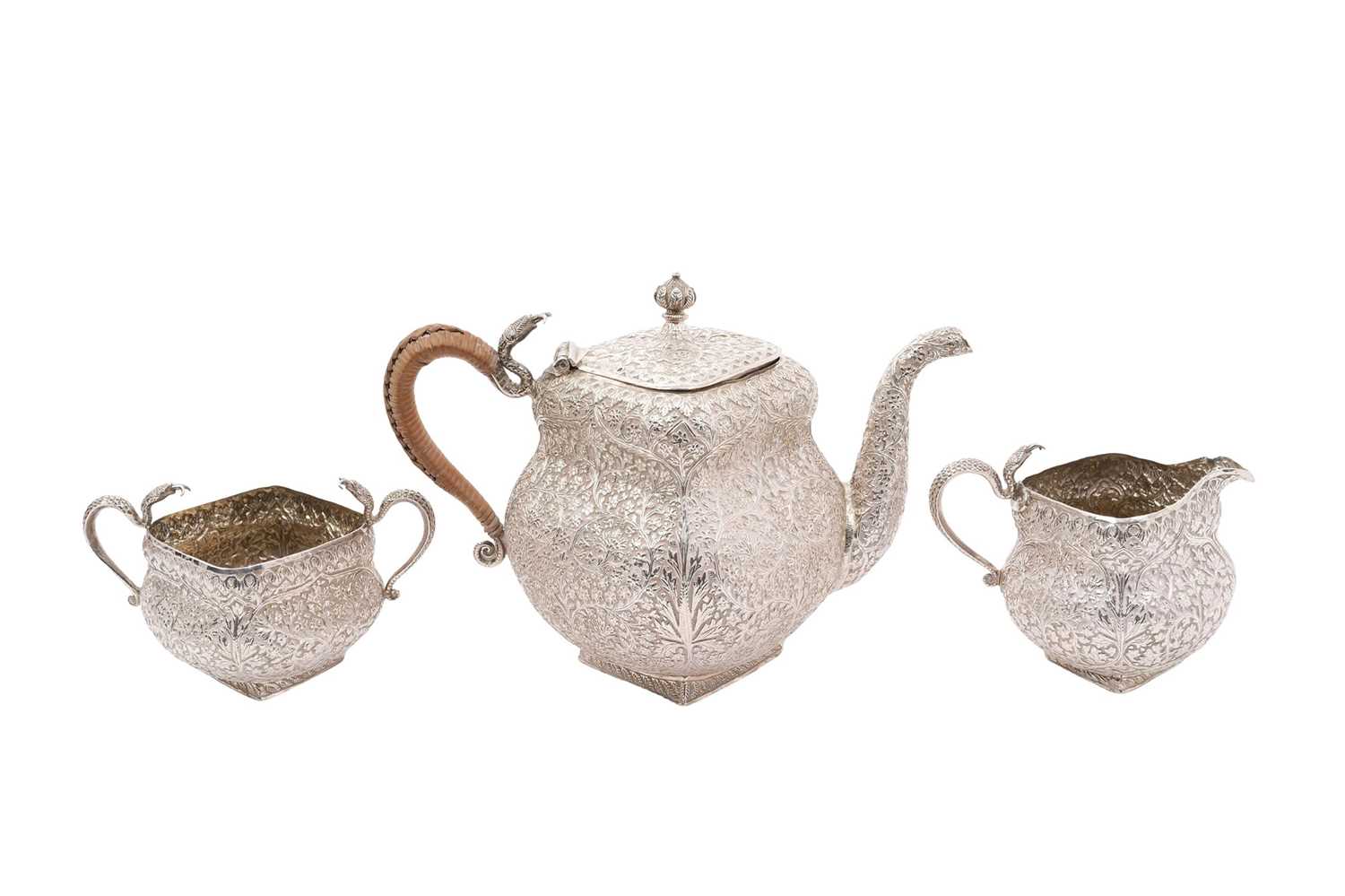 Lot 298 - Late 19th/early 2oth century Indian white metal three piece tea set with snake handles