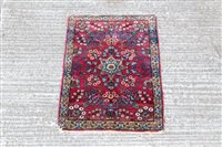 Lot 1781 - Small Eastern rug - with claret field centred...