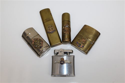 Lot 734 - Group of five lighters with military...