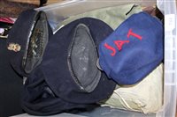 Lot 744 - Military berets, together with combat dress...