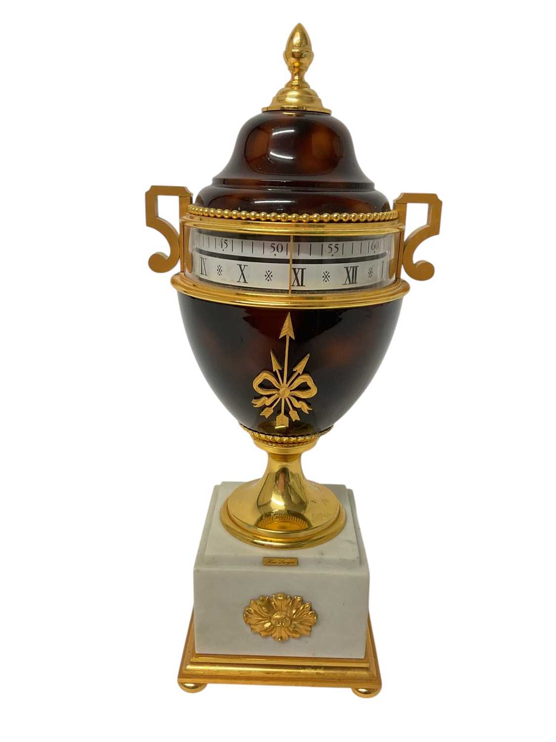 Lot 736 - Modern Louis XVI style urn shaped clock, by Hour Lavigne, brown lacquered and gilt, on a marble base, with horizontal rotating dial, 35cm high