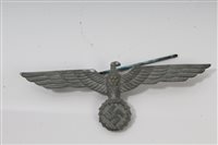 Lot 758 - Nazi eagle and swastika cap badge with pin...