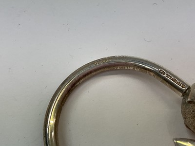 Lot 1010 - Tiffany & Co silver aeroplane and globe key ring (London 1999), in pouch