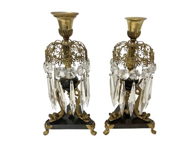 Lot 975 - Pair of Regency ormolu candlesticks with cut glass lustres