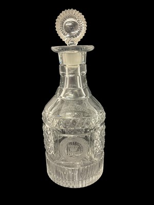 Lot 225 - A George III cut glass decanter with armorial crest