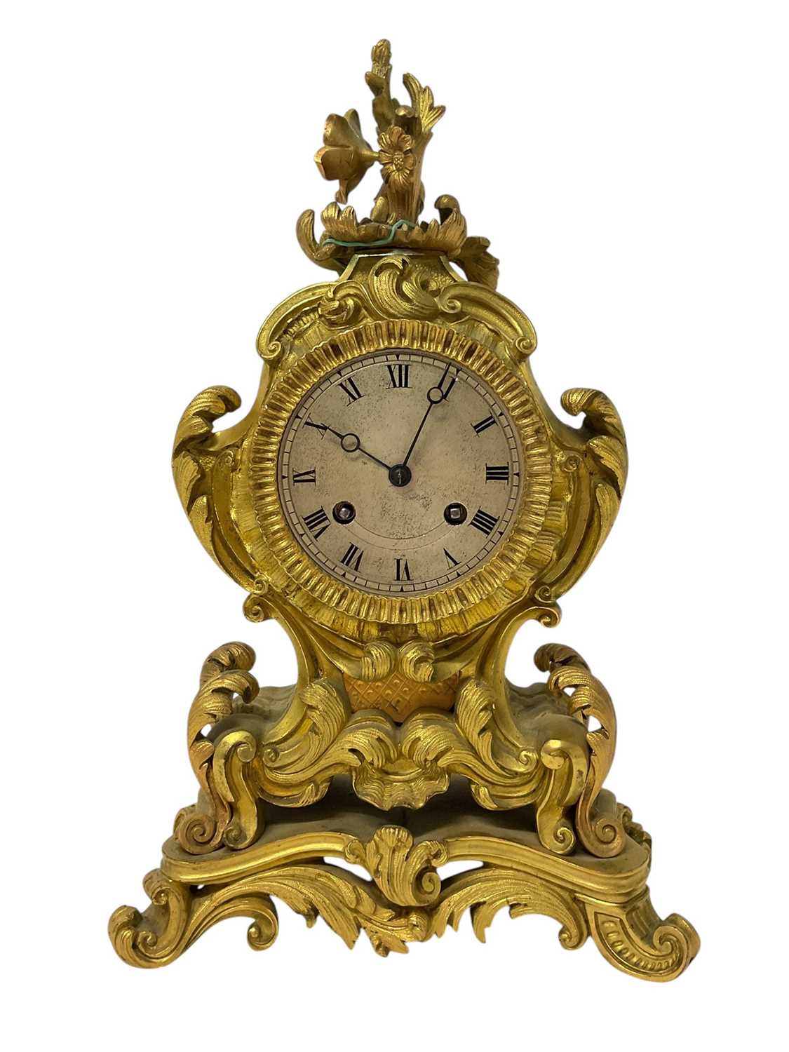 Lot 610 - 19th century French ormolu mantel clock with silvered dial and ornate floral scroll case