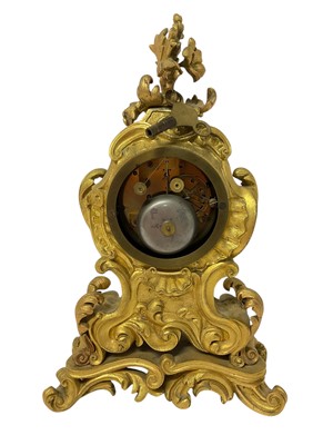 Lot 610 - 19th century French ormolu mantel clock with silvered dial and ornate floral scroll case