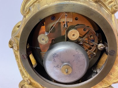 Lot 610 - 19th century French ormolu mantel clock with silvered dial and ornate floral scroll case