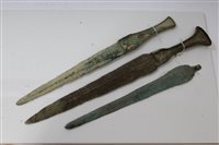 Lot 817 - Two ancient bronze daggers / shortswords -...