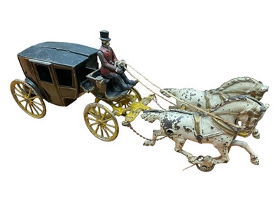 Lot 2049 - Cast iron model of a coach and horses