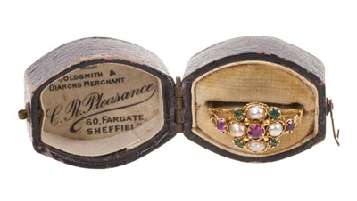 Lot 485 - Early Victorian ruby, emerald and pearl cluster ring in gold setting with pierced scroll shoulders on engraved gold shank, in a Victorian ring box. Ring size O.