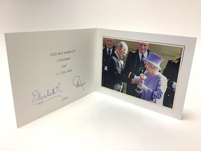 Lot 75 - H.M. Queen Elizabeth II and H.R.H. The Duke of Edinburgh, signed 2012 Christmas card with twin gilt Royal cyphers to the cover, colour photograph to the interior of the beaming Royal couple afte...