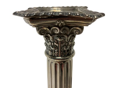 Lot 254 - Pair of silver Corinthian column candlesticks