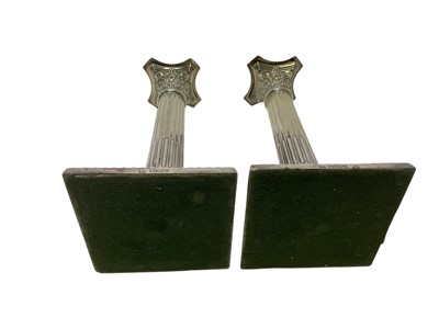 Lot 254 - Pair of silver Corinthian column candlesticks