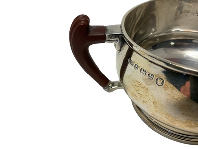 Lot 257 - Stylish Art Deco silver three piece tea set with Bakelite handles